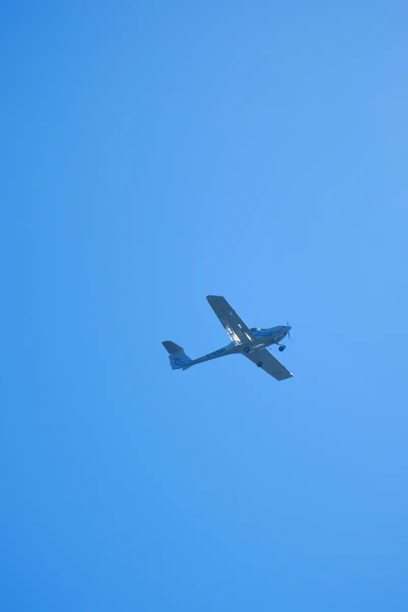 A small plane against a clear blue sky